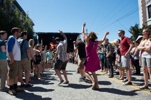Festivalgoers dance in the street on Saturday (photo: Jim Bennett)