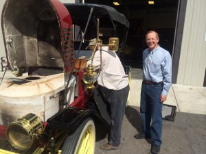 Museum owner Tim Cerny (right) and museum manager Willy Vinton prepare a 1910 Stanley Steamer for display (photo: Gene Stout)