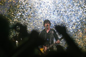 Billie Joe Armstrong of Green Day performs in a shower of graffiti last summer at KeyArena (photo: www.stevenfriederich.com)